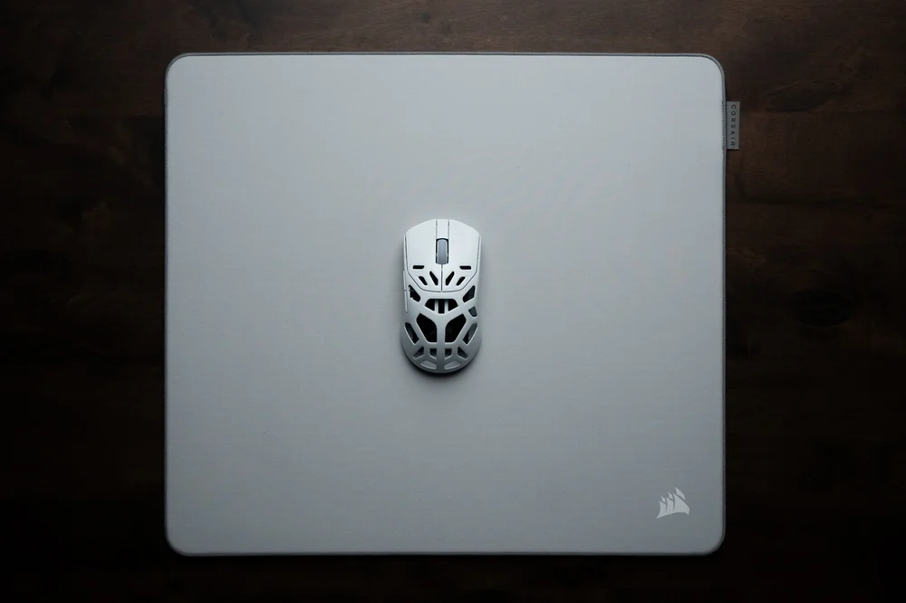 A gray MM PRO CONTROL mouse mat with Sabre v2 PRO MG