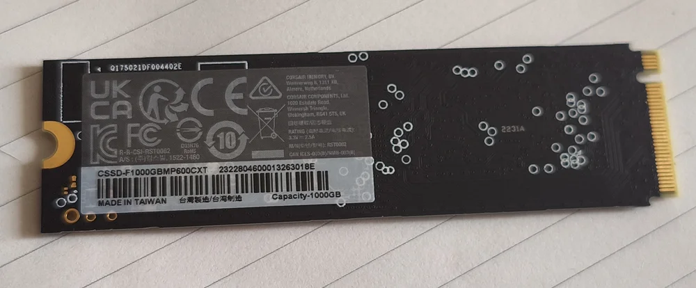 Photograph of the underside of an SSD showing the serial number location